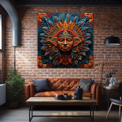 Cuadro xipe totec en formato cuadrado con colores azul, morado, naranja; decorando pared ladrillos